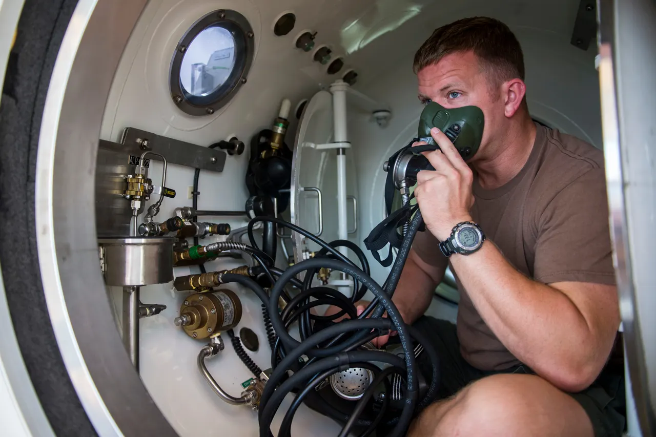 Divers operating a recompression chamber aboard a salvage vessel